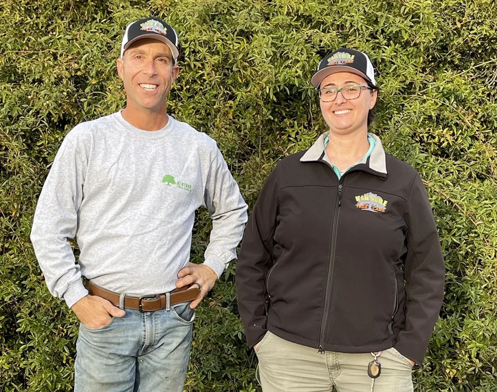 Fred Frey, an ISA Certified Arborist and owner of Vintage Tree Care, standing next to Kamala Dionne an ISA Certified Arborist who works at Vintage Tree Care